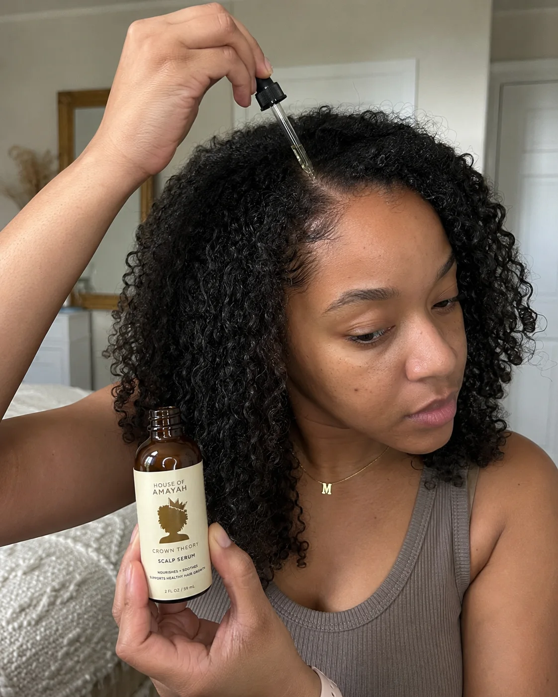 Crown Theory Scalp Serum being applied to hair